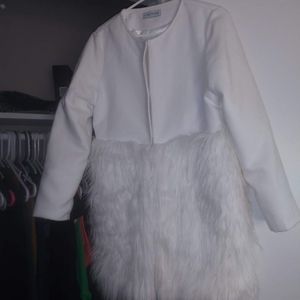 White faux fur jacket.